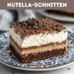 Nutella-Schnitten – saftiger Schokoladenkuchen mit cremiger Nutella-Füllung und Schokostreuseln, perfekt für süße Dessertliebhaber